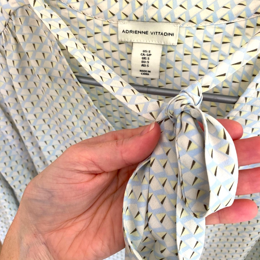 Slinky material dress top with tie peep hole in front! Soft blues and tan colors